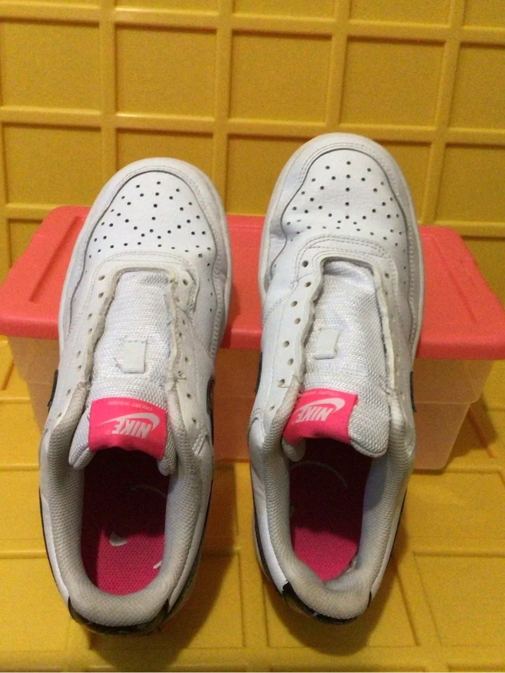 Nike White Kids Sneakers with Black Swoosh and Pink Tongue Accent